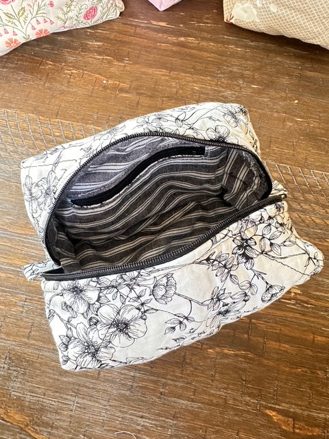 The Black Floral Quilted Makeup Bag